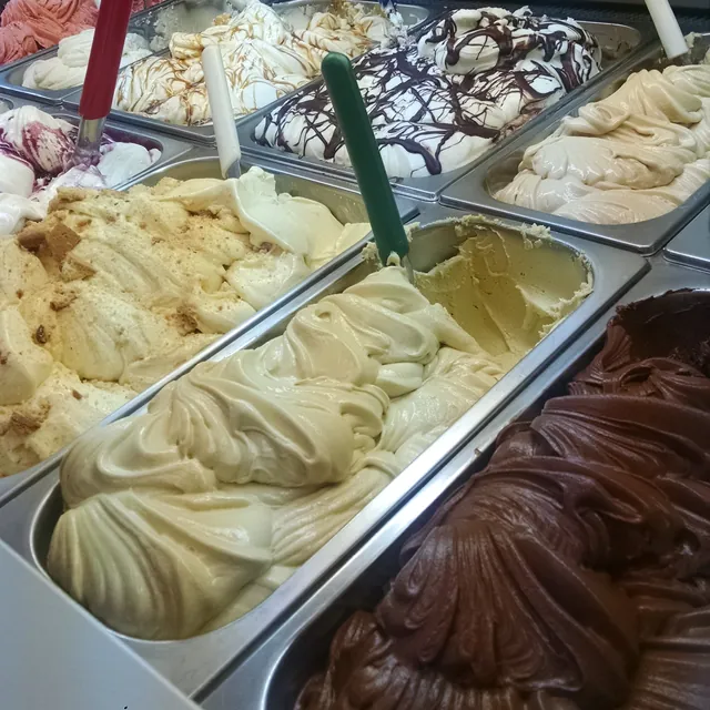 Pans of gelato in the display case